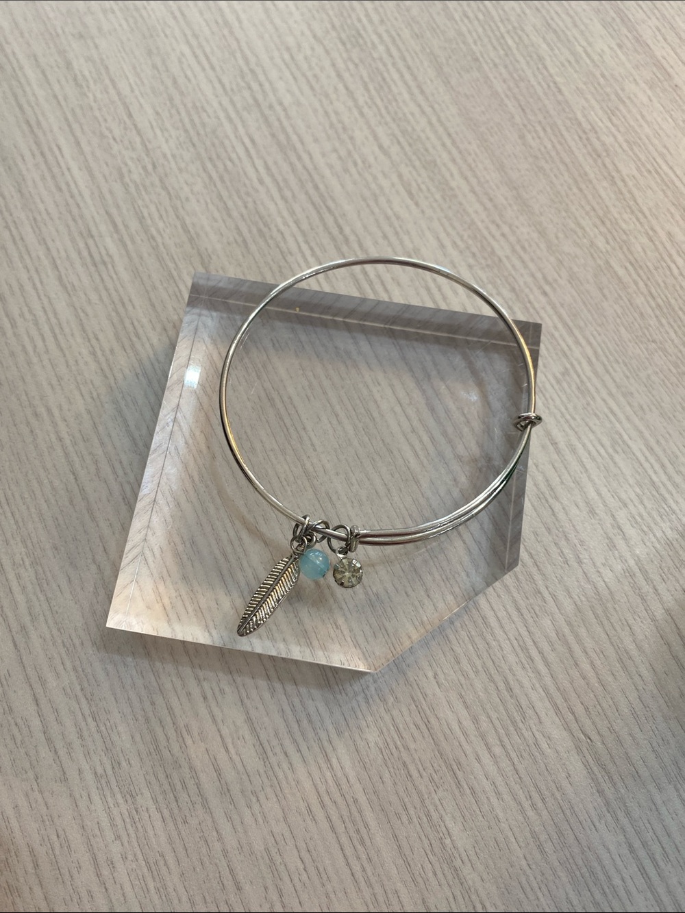 Silver Tone Charm Bangle Bracelet with Blue Bead and Feather Charm